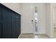 Welcoming entryway featuring a coat rack and neutral decor at 434 N Old Hammer St, Aurora, CO 80018