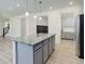 Open-concept kitchen with a large center island and plenty of storage at 434 N Old Hammer St, Aurora, CO 80018