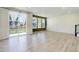 Spacious living room with wood floors, a large sliding glass door and large windows with bright light at 434 N Old Hammer St, Aurora, CO 80018