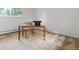 Bright bedroom with carpet, simple desk, chair, vintage typewriter, and a large window overlooking the neighborhood at 101 S Downing St # 8, Denver, CO 80209