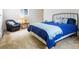 Cozy bedroom featuring plush carpet, a comfortable chair, and a stylish bed with blue bedding at 101 S Downing St # 8, Denver, CO 80209
