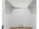 Walk-in closet features upper shelving and lower vent at 101 S Downing St # 8, Denver, CO 80209