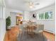 Bright dining room featuring hardwood floors, a modern ceiling fan, and a round table set for a meal at 101 S Downing St # 8, Denver, CO 80209