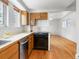 Functional kitchen design with stainless appliances and natural wood cabinets at 101 S Downing St # 8, Denver, CO 80209