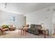 Comfortable living room features neutral carpet and ample natural light at 101 S Downing St # 8, Denver, CO 80209