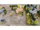 Aerial view of a home set on a spacious lot with mature trees and a large field at 8895 Morton Rd, Niwot, CO 80503
