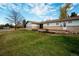 Well-maintained lawn with a wooden deck offers great outdoor living space at 8895 Morton Rd, Niwot, CO 80503