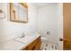 Bathroom with white walls, neutral vanity, and patterned tile flooring at 8895 Morton Rd, Niwot, CO 80503