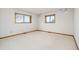 Bright bedroom with two large windows, neutral carpet, and white walls at 8895 Morton Rd, Niwot, CO 80503
