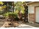 A small, private yard with a gate and garden detailing at 8895 Morton Rd, Niwot, CO 80503