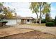 Daytime shot of the home featuring mature trees, well-maintained lawn, and inviting front entrance at 8895 Morton Rd, Niwot, CO 80503