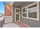 Balcony with wood decking featuring a wood pergola and string lights at 7870 W 43Rd Pl, Wheat Ridge, CO 80033