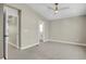 Bedroom featuring a ceiling fan and doorways to other rooms at 7870 W 43Rd Pl, Wheat Ridge, CO 80033