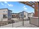 Community view from balcony features modern townhomes with a mix of siding and brick accents at 7870 W 43Rd Pl, Wheat Ridge, CO 80033