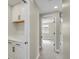 Hallway featuring a built-in cabinet and a view into another bedroom at 7870 W 43Rd Pl, Wheat Ridge, CO 80033