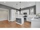 Spacious kitchen island features stainless steel appliances and ample natural light at 7870 W 43Rd Pl, Wheat Ridge, CO 80033