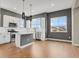 Modern kitchen features a large island, stainless steel appliances and ample cabinet space at 7870 W 43Rd Pl, Wheat Ridge, CO 80033