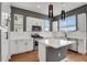 Bright kitchen with a large island, stainless steel appliances and sleek countertops at 7870 W 43Rd Pl, Wheat Ridge, CO 80033