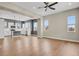 Bright, open-concept living room features modern decor, hardwood floors, and a seamless flow into the kitchen at 7870 W 43Rd Pl, Wheat Ridge, CO 80033
