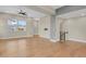 Open living space with hardwood floors, modern fixtures, and staircase access at 7870 W 43Rd Pl, Wheat Ridge, CO 80033