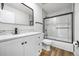 Modern bathroom features a new vanity, white marble, and a glass-enclosed shower for a sleek, updated design at 18438 E Berry Dr, Centennial, CO 80015