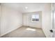 Neutral-toned bedroom with plush carpeting, natural light from the window, and a double-door closet at 18438 E Berry Dr, Centennial, CO 80015