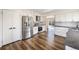 Updated kitchen featuring stainless steel appliances, white cabinets, and a tile backsplash at 18438 E Berry Dr, Centennial, CO 80015