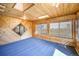 Cozy sun room with wood paneled walls and ceilings, skylight, and bright windows perfect for relaxing at 18438 E Berry Dr, Centennial, CO 80015