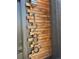 Close-up of the address on a wood slat background, with a modern light fixture above at 1285 Roslyn St, Denver, CO 80220