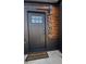 Stylish front door with address numbers, a modern exterior, and a 'Home Sweet Home' doormat at 1285 Roslyn St, Denver, CO 80220