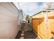 Backyard access through a gated pathway at 1716 Moline St, Aurora, CO 80010