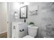 Updated bathroom with white vanity and marble-look shower/tub combo at 1716 Moline St, Aurora, CO 80010