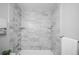 Clean bathroom with marble-look shower/tub combo at 1716 Moline St, Aurora, CO 80010