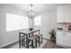 Small dining area with a table and four stools, near the kitchen at 1716 Moline St, Aurora, CO 80010