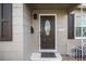 Inviting front door with an oval window and dark brown finish at 1716 Moline St, Aurora, CO 80010