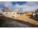 View of house back, yard, and shed at 1716 Moline St, Aurora, CO 80010