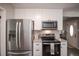 Modern kitchen featuring stainless steel appliances and white shaker cabinets at 1716 Moline St, Aurora, CO 80010