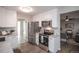 Updated kitchen featuring white cabinets, granite countertops, and stainless steel appliances at 1716 Moline St, Aurora, CO 80010