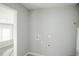 Laundry room with hookups and additional storage at 1716 Moline St, Aurora, CO 80010