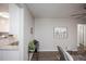 Bright living room with hardwood floors, neutral walls, and mid-century modern furniture at 1716 Moline St, Aurora, CO 80010