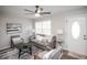 Spacious living room with hardwood floors, gray sofa, and plenty of natural light at 1716 Moline St, Aurora, CO 80010