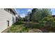 A view of the backyard with a detached garage and deck at 8389 Benton Way, Arvada, CO 80003
