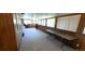Spacious basement with paneled walls, carpeting, and multiple windows at 8389 Benton Way, Arvada, CO 80003