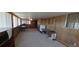 Large basement space with paneling, carpet flooring, and ample natural light at 8389 Benton Way, Arvada, CO 80003