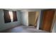 Cozy bedroom features soft lighting and a small closet at 8389 Benton Way, Arvada, CO 80003