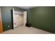 Bedroom features a built-in closet with bi-fold doors and a neutral carpet at 8389 Benton Way, Arvada, CO 80003