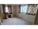 Bedroom with a classic wood desk and natural light at 8389 Benton Way, Arvada, CO 80003