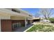 Close-up of the front porch with brick accents and a covered entryway at 8389 Benton Way, Arvada, CO 80003