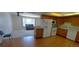 Eat-in kitchen with an open floor plan looking into the living room at 8389 Benton Way, Arvada, CO 80003