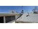 Exterior roof shot shows the roof, ventilation, and surrounding trees at 8389 Benton Way, Arvada, CO 80003